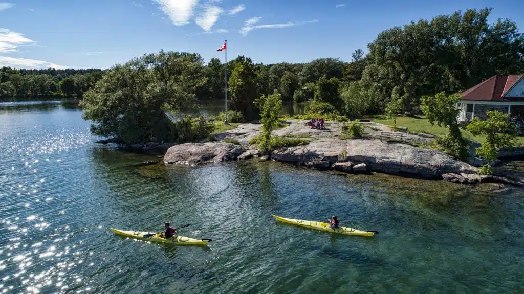 Two people kayaking in Ontario Lake. 